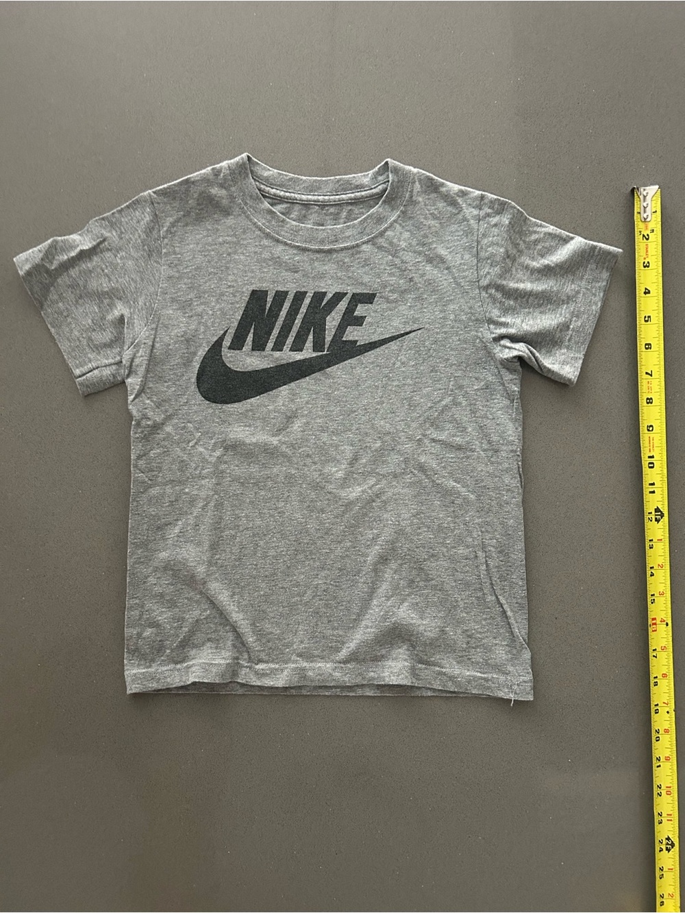 Nike Gray Short Sleeve Tee with Black Swoosh kids size 7…
